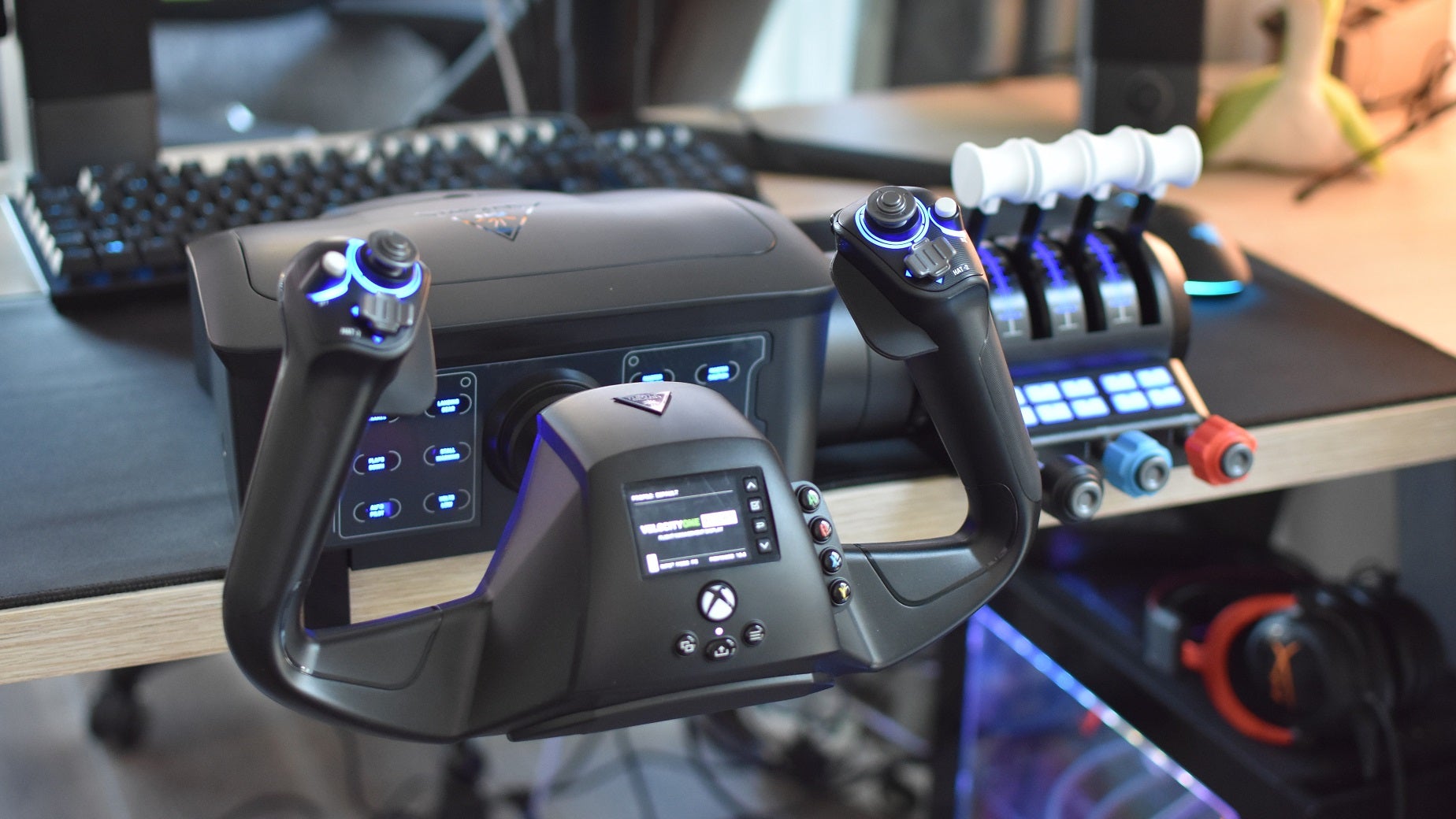 The Turtle Beach VelocityOne Flight yoke controller, powered up and affixed to a desk.