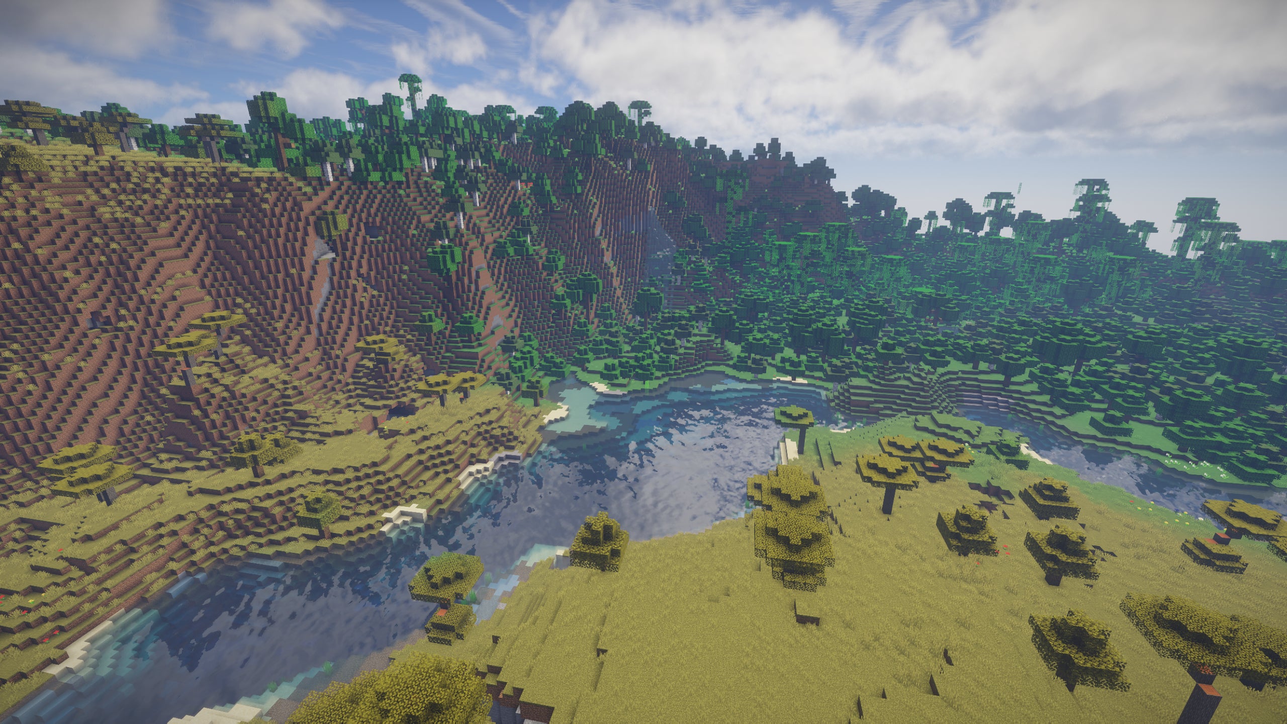 A river on the edge of a forest in Minecraft, with extreme hills on the left in the distance.