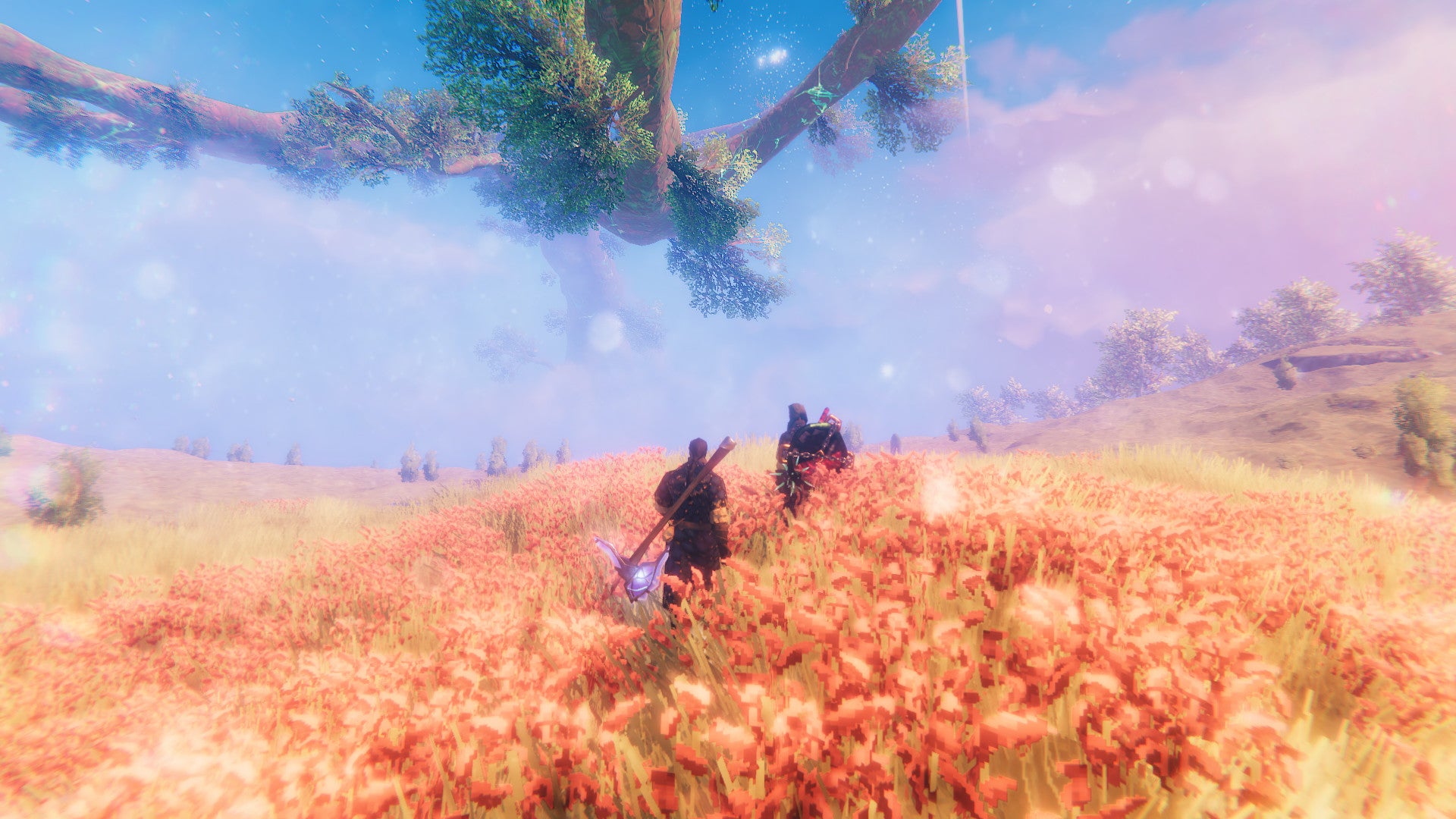 Two Vikings traversing the Plains biome in Valheim, under the shadow of Yggdrasil.