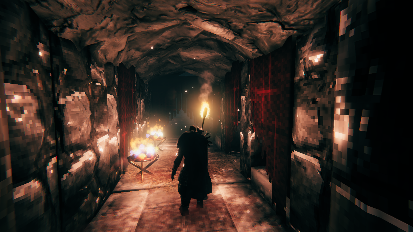Walking through a tunnel illuminated by a torch in a screenshot of Valheim's Mountains update.