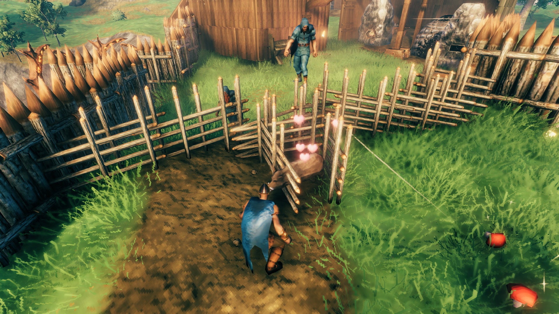 A screenshot from Valheim, which shows a boar impaled on some spikes, yet still alive and happy.