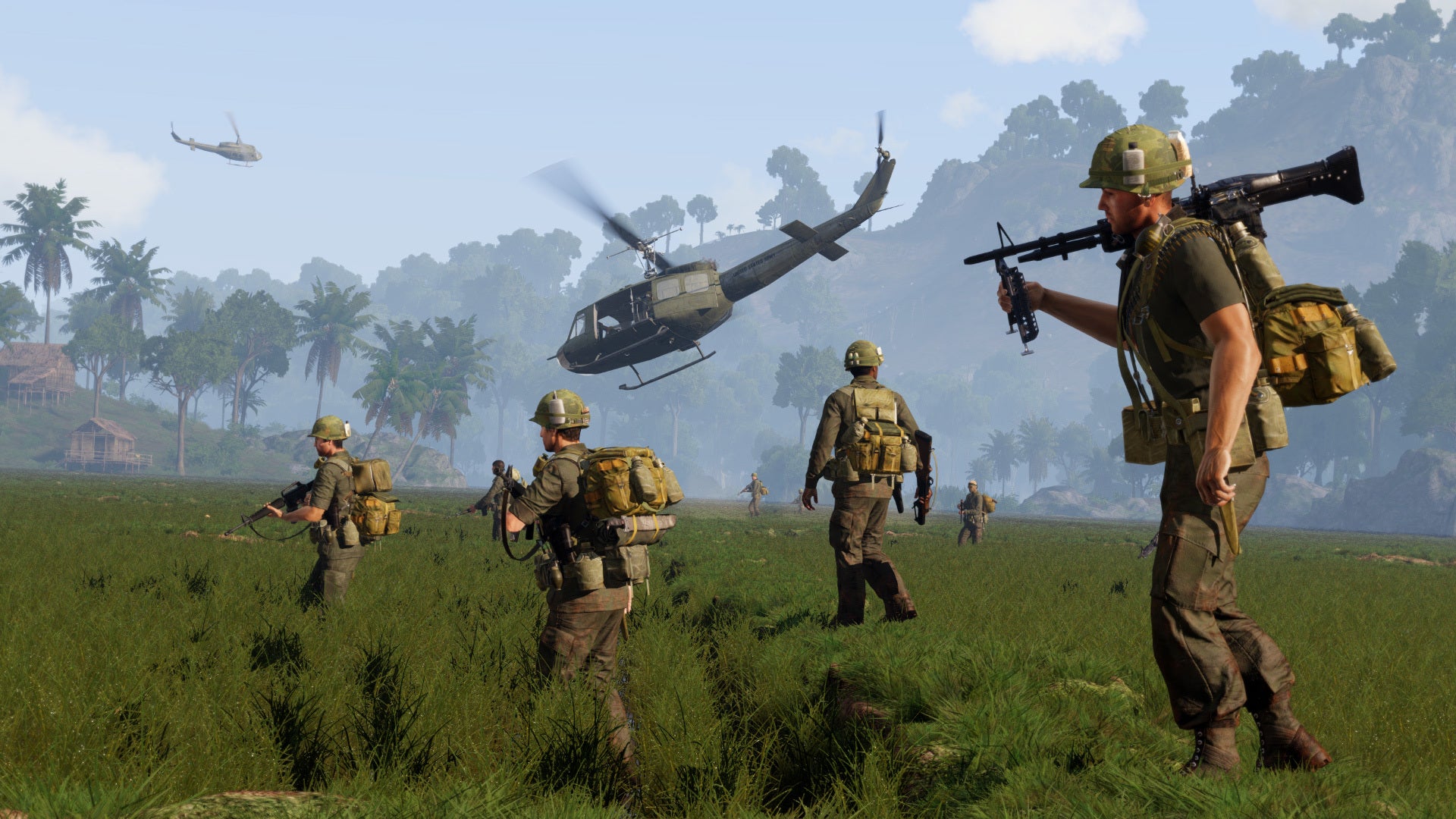 A sicrrenshot of Arma 3's Vietnam DLC. It shows a number of troops crossing a field, supported by two helicopters.