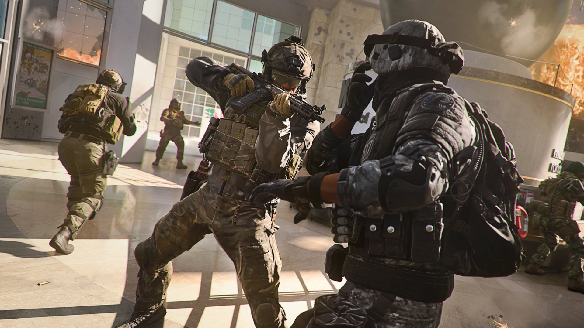 A soldier in Warzone 2.0 threatens an enemy with their rifle while their squadmates secure the indoor area around them.