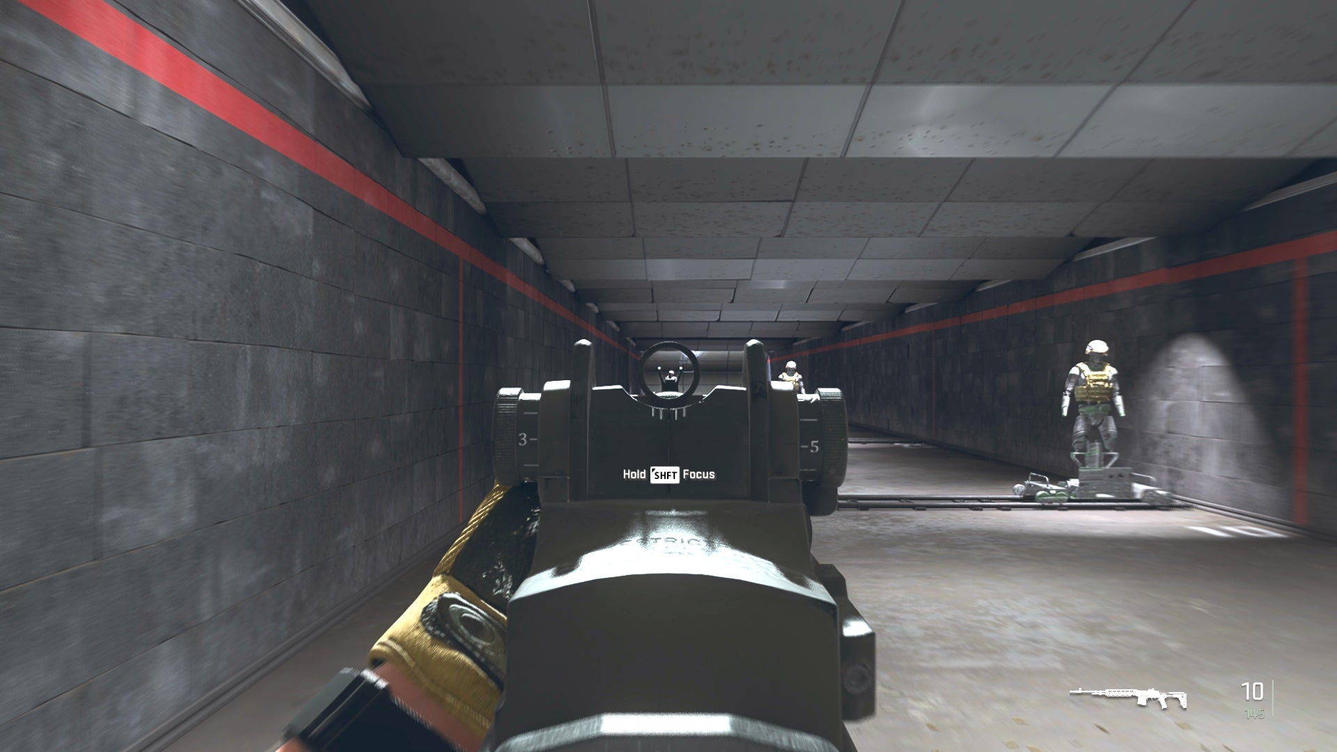 The player in Warzone 2.0 aims at a training dummy with the EBR-14 ironsights.