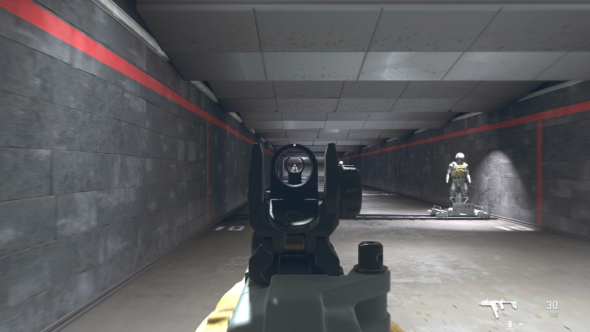 The player in Warzone 2.0 aims at a training dummy with the Fennec 45 ironsights.