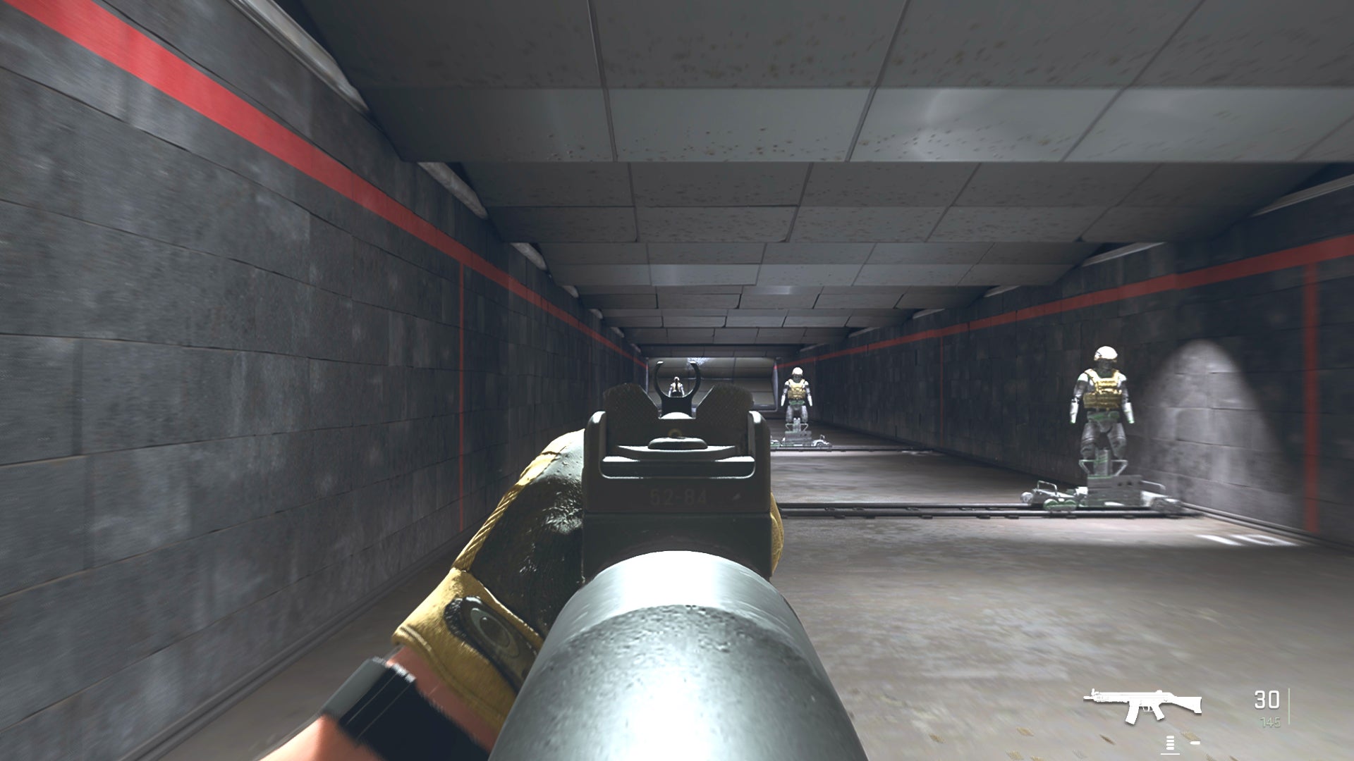 The player in Warzone 2.0 aims at a training dummy with the Lachmann-556 ironsights.