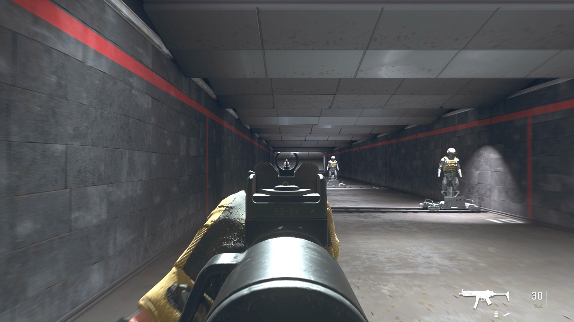 The player in Warzone 2.0 aims at a training dummy with the Lachmann Sub ironsights.