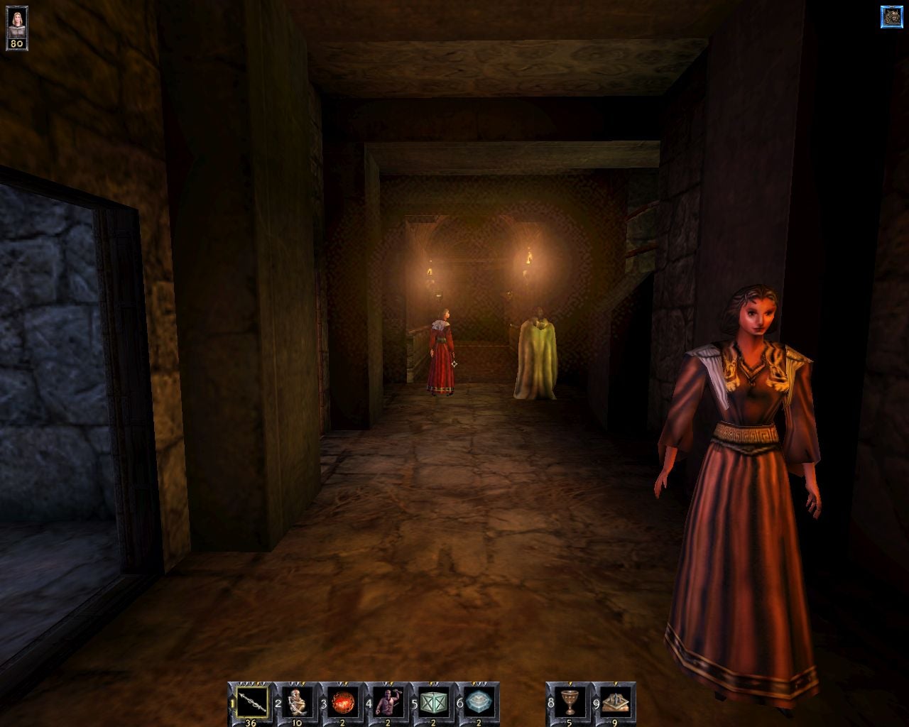 Robed people in a corridor in a The Wheel of Time screenshot.