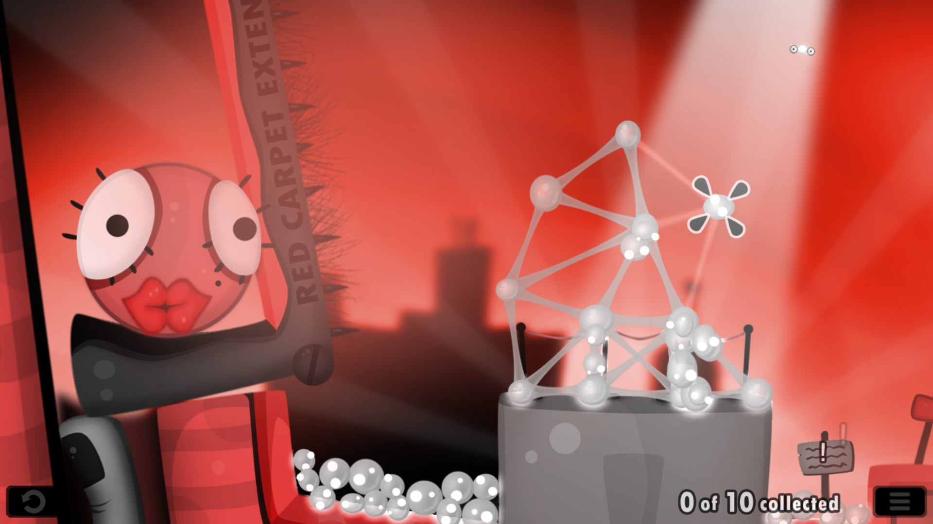 A level in World Of Goo with a structure of white goo balls on the right, and a giant red Goo ball on the left awaiting its freedom.