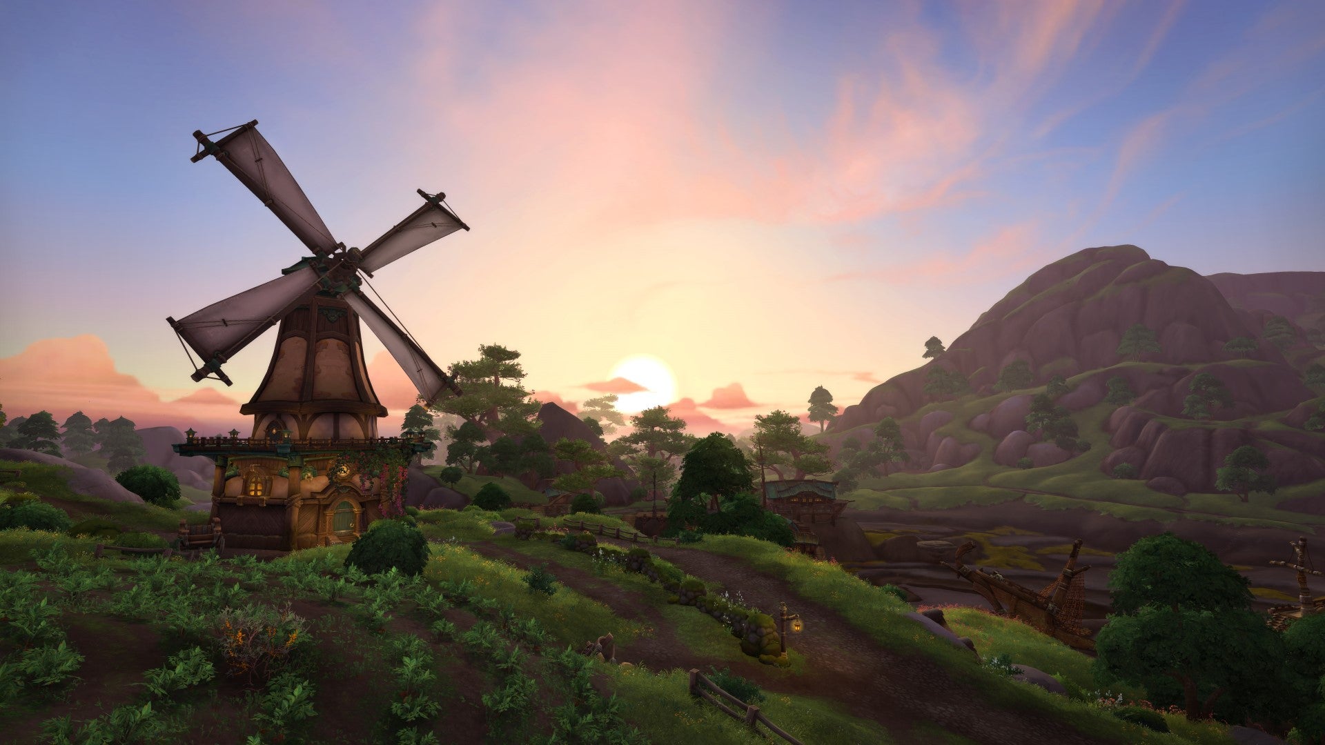 A vista of Stormsong from World Of Warcraft, with lovely rolling hills and a windmill.