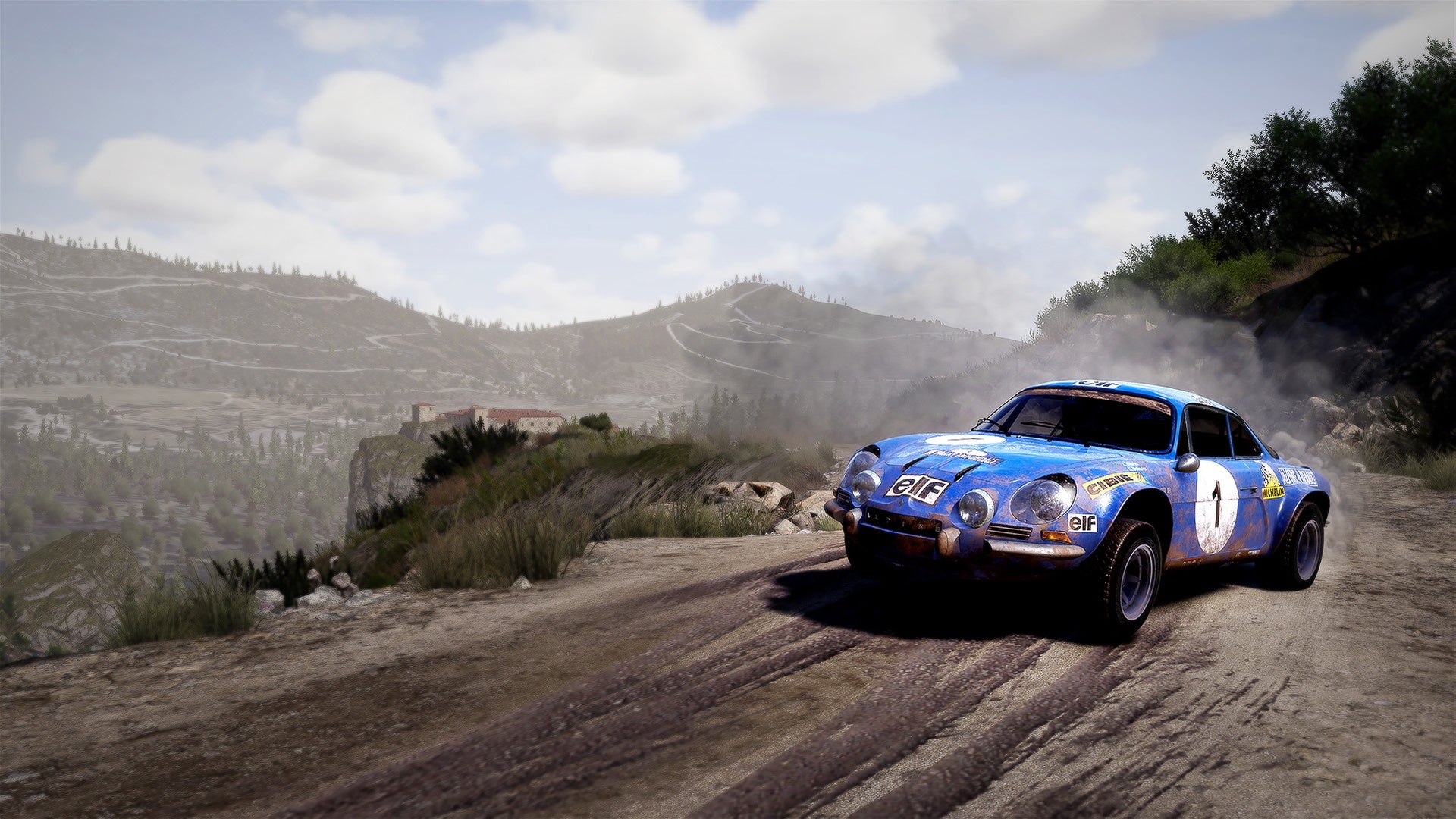 A blue rally car skids round a dusty road in WRC 10.